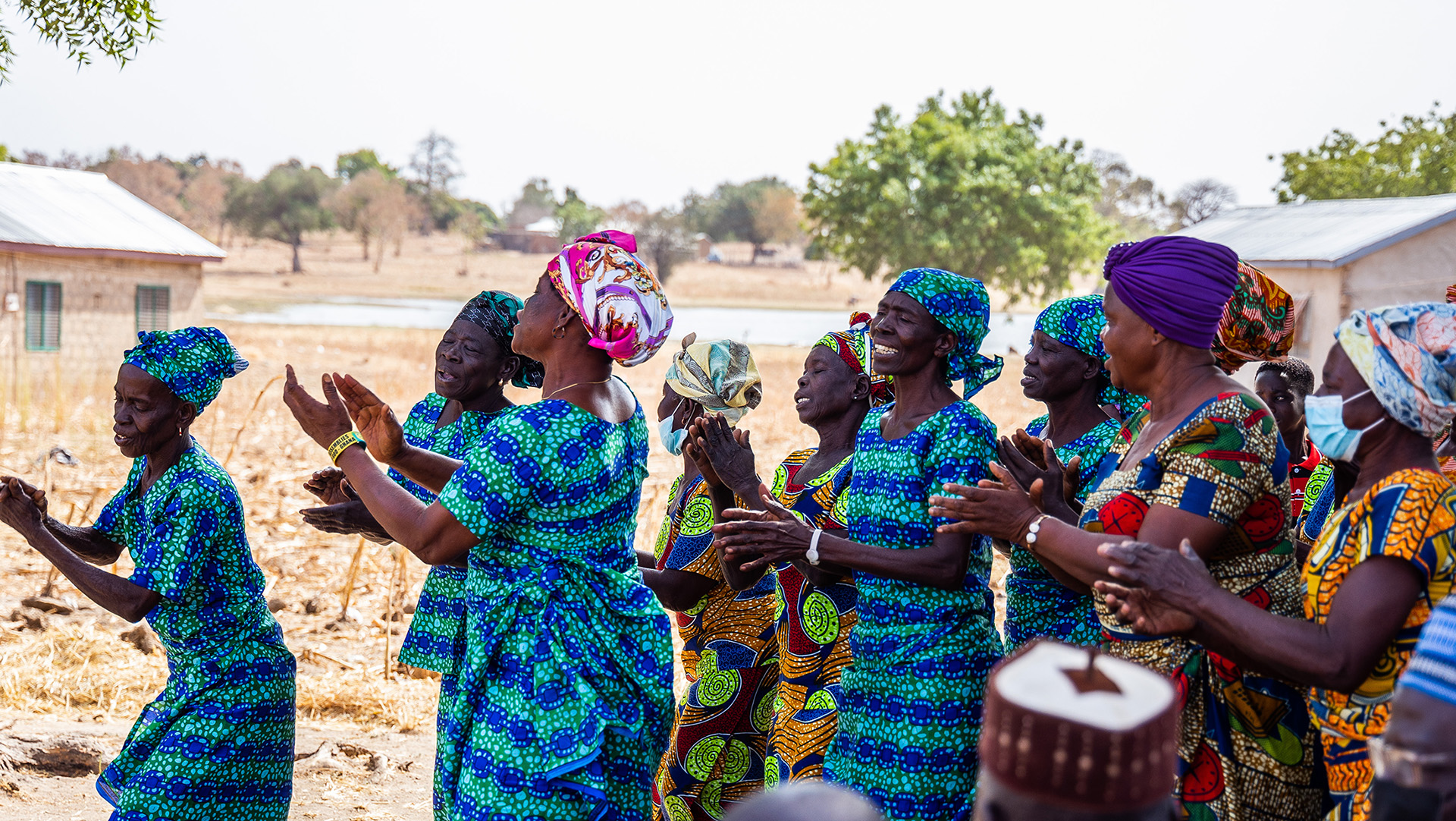A group of women wearing blue dancing.