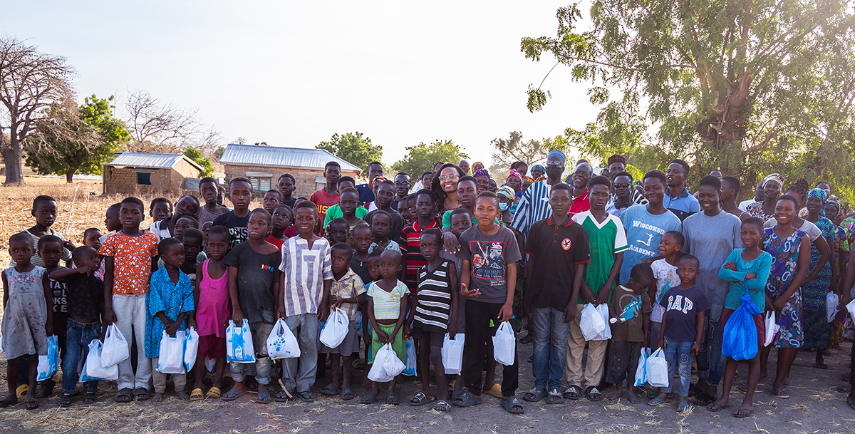 A large group of children holding bags