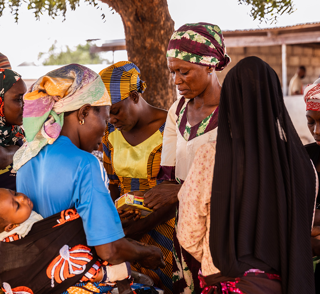 A group of Ghanaian women opening provisions