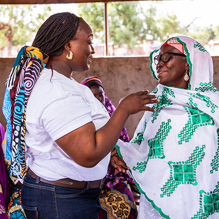 Two women talking to one another